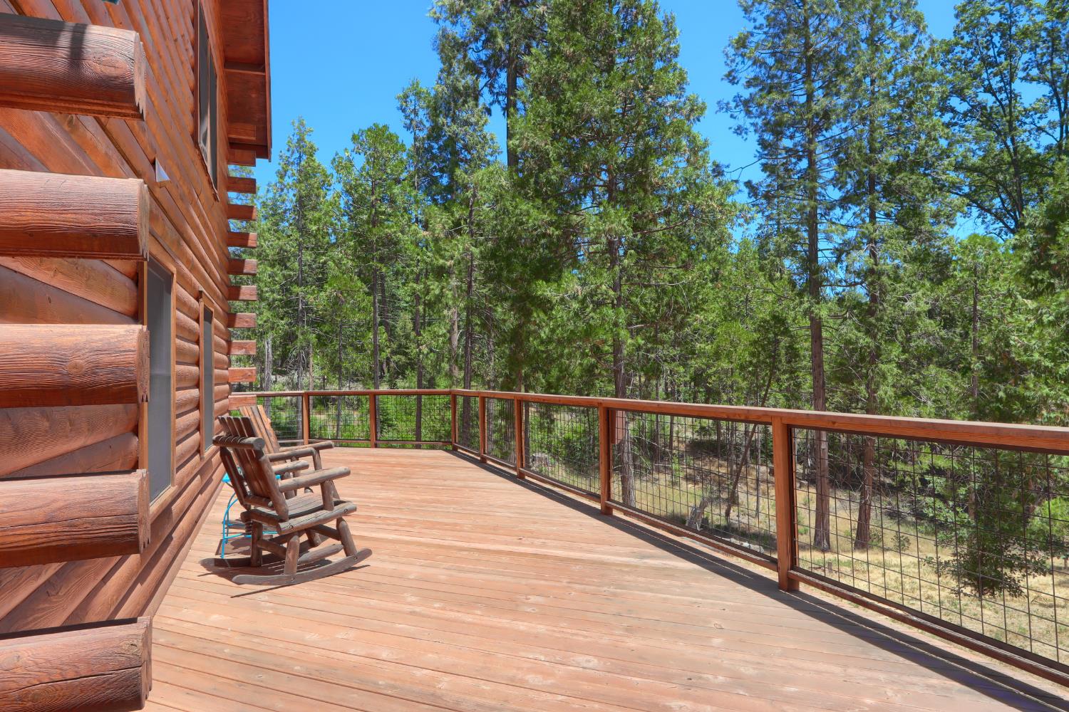 7190 Hites Cove Road Mariposa, CA 95338 - Photo 34 of 61 a view of balcony with wooden floor and fence
