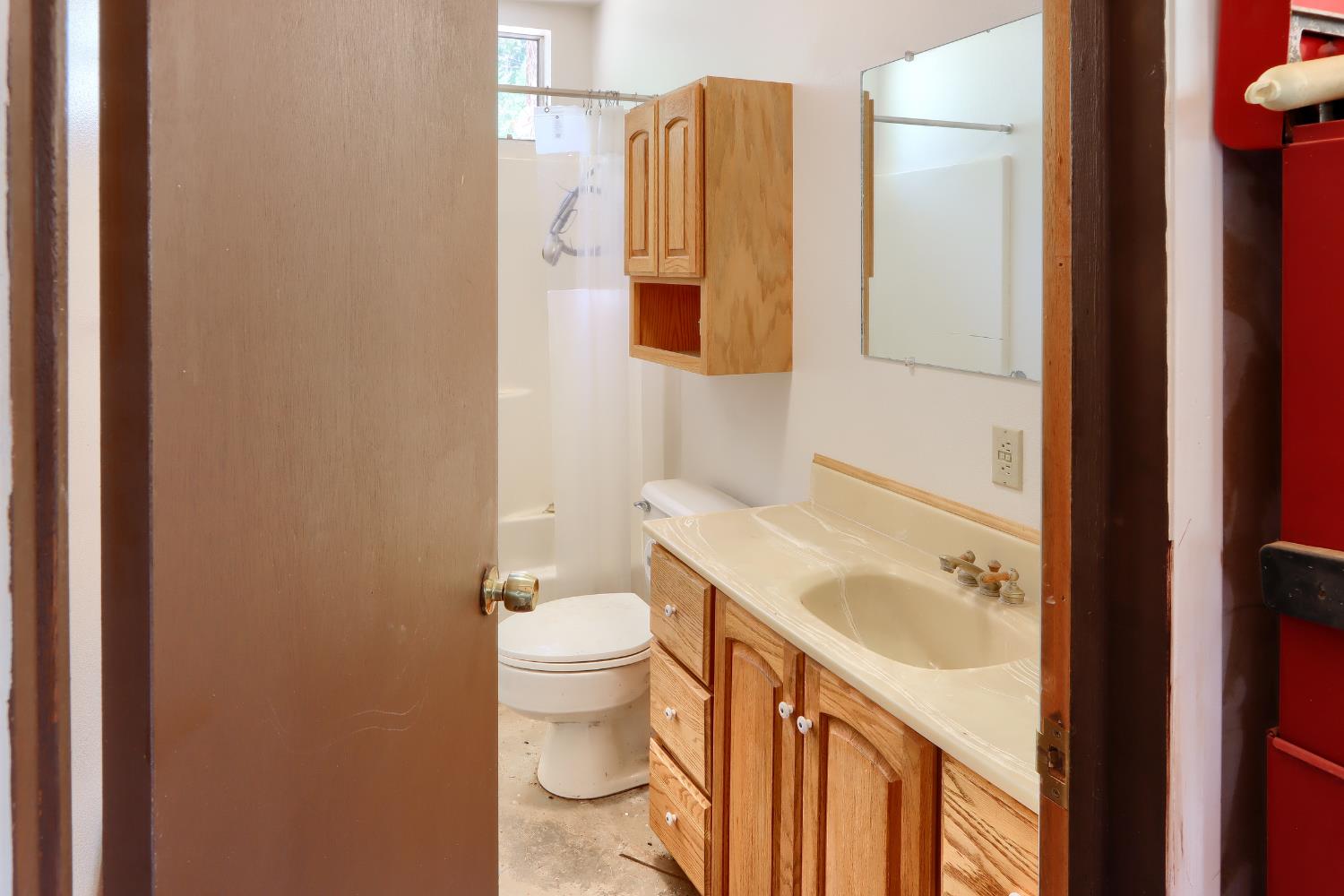 7190 Hites Cove Road Mariposa, CA 95338 - Photo 37 of 61 a bathroom with a sink toilet and shower