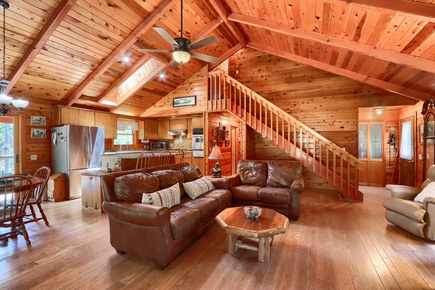 7190 Hites Cove Road Mariposa, CA 95338 - Photo 10 of 61 a living room with furniture and a wooden floor