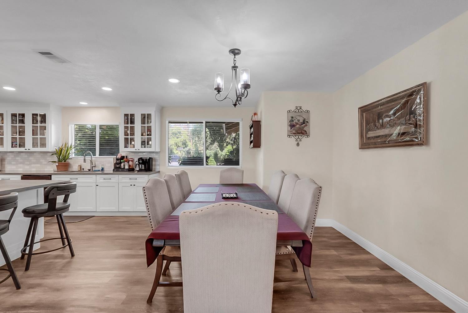 6112 Slaton Court Stockton, CA 95215 - Photo 12 of 46 a living room with furniture a dining table and a large window