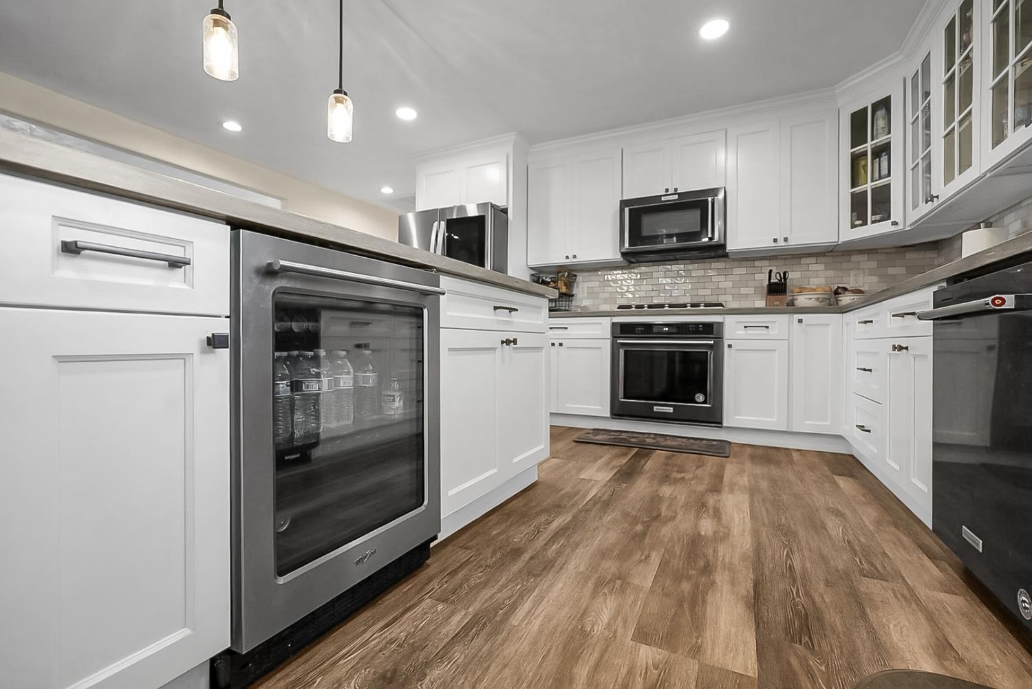 6112 Slaton Court Stockton, CA 95215 - Photo 14 of 46 a kitchen with stainless steel appliances granite countertop a stove and a refrigerator