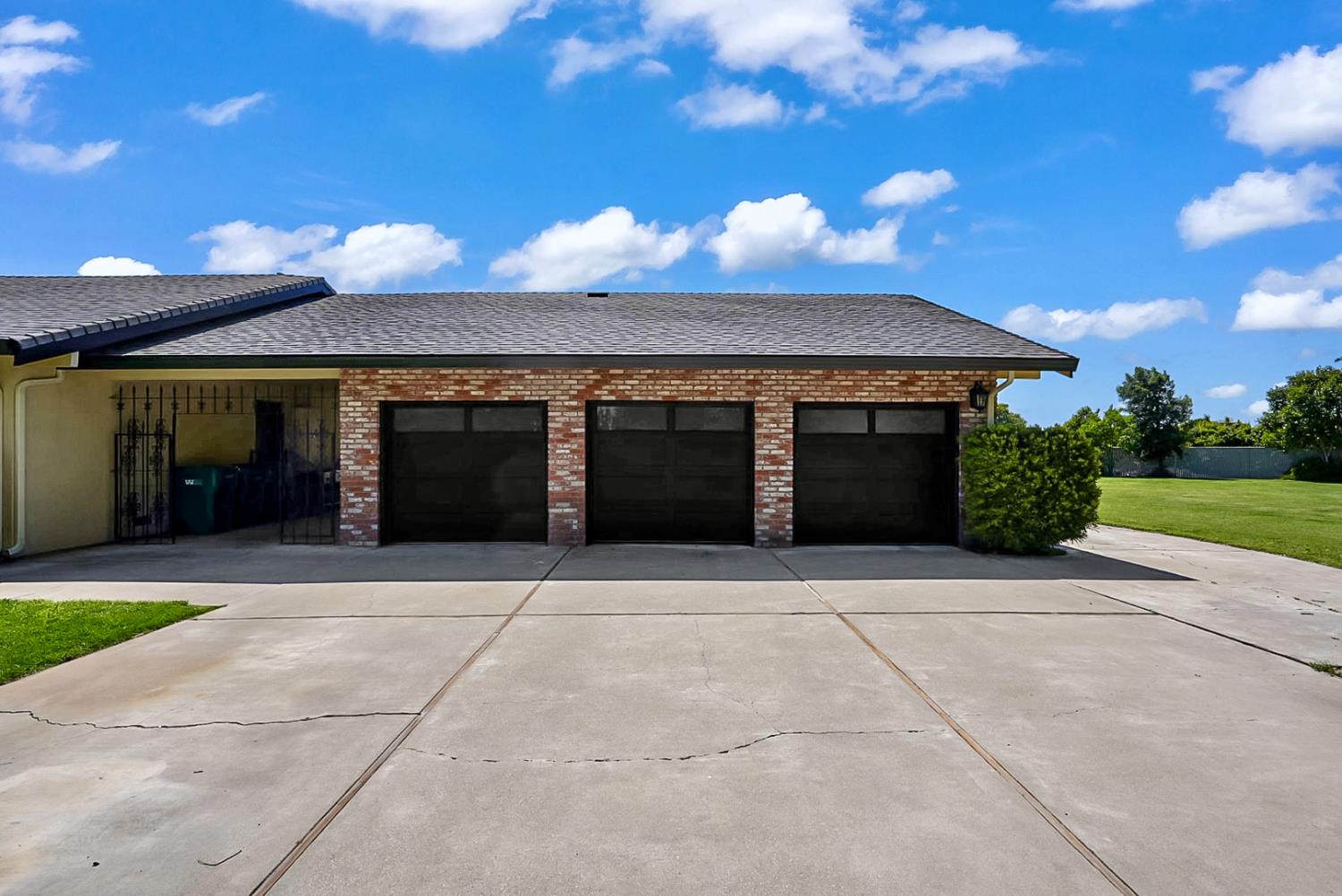 6112 Slaton Court Stockton, CA 95215 - Photo 27 of 46 a front view of a house with a yard and garage