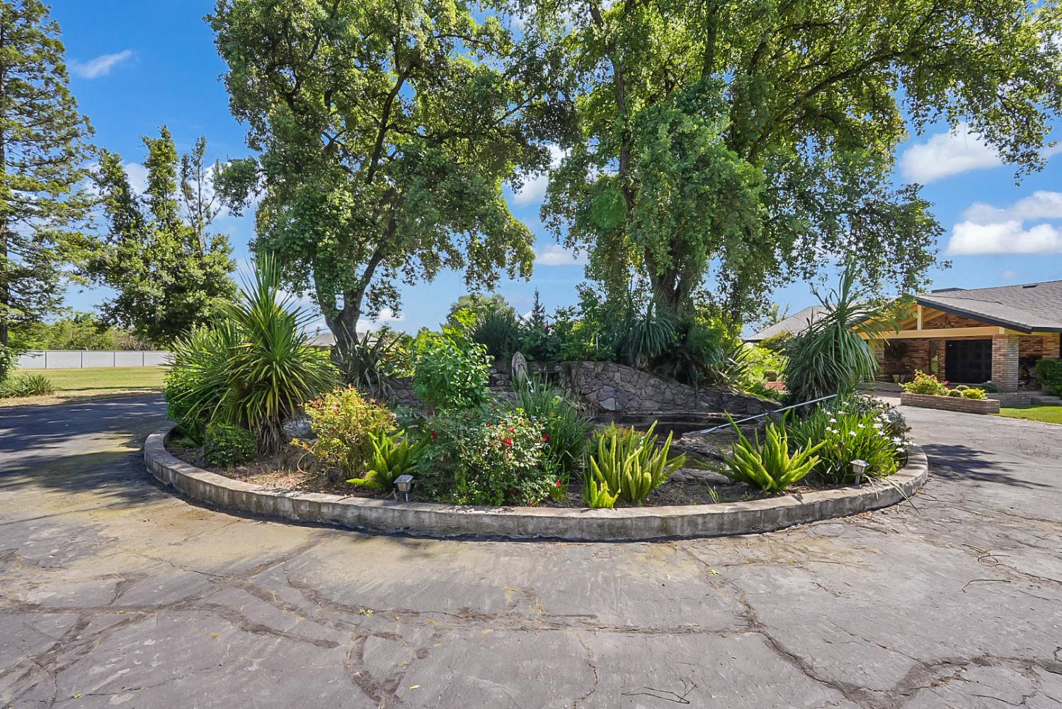 6112 Slaton Court Stockton, CA 95215 - Photo 3 of 46 a front view of a house with a yard and a outdoor seating