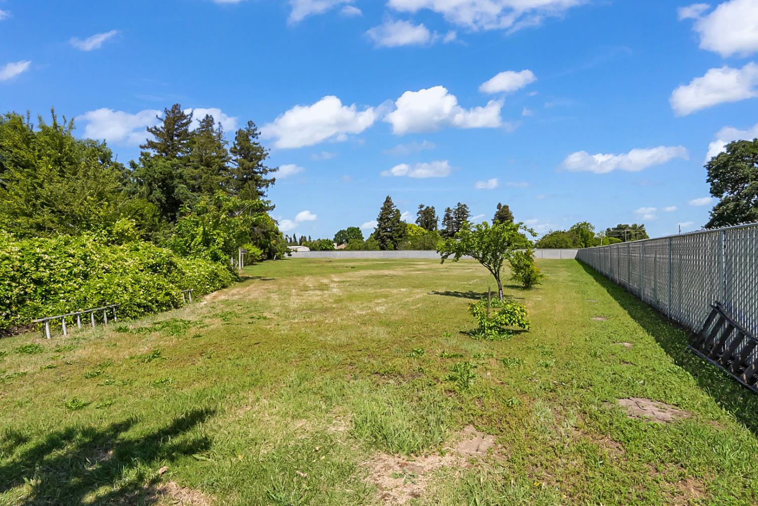 6112 Slaton Court Stockton, CA 95215 - Photo 42 of 46 a view of a big yard with swimming pool and green space