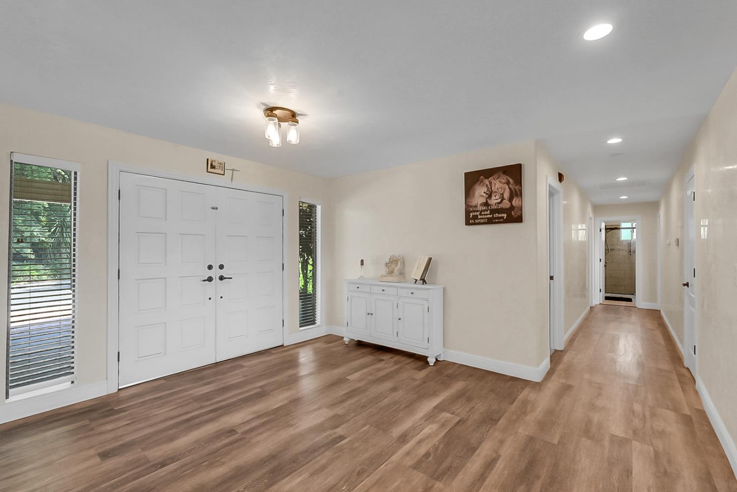 6112 Slaton Court Stockton, CA 95215 - Photo 5 of 46 an empty room with wooden floor and windows