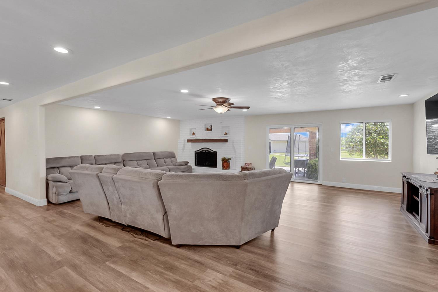 6112 Slaton Court Stockton, CA 95215 - Photo 8 of 46 a living room with furniture and a fireplace