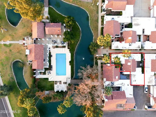 an aerial view of residential houses with outdoor space