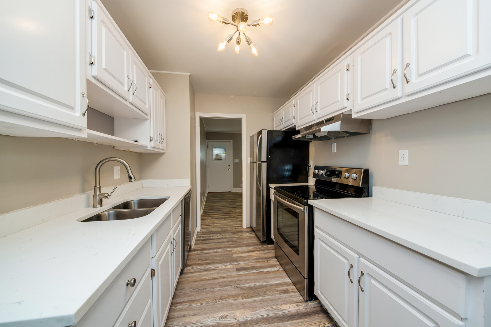 24 Greenbriar Road Montgomery, IL 60538 - Photo 5 of 16 a kitchen with stainless steel appliances granite countertop a sink stove refrigerator a kitchen island with cabinets and wooden floor