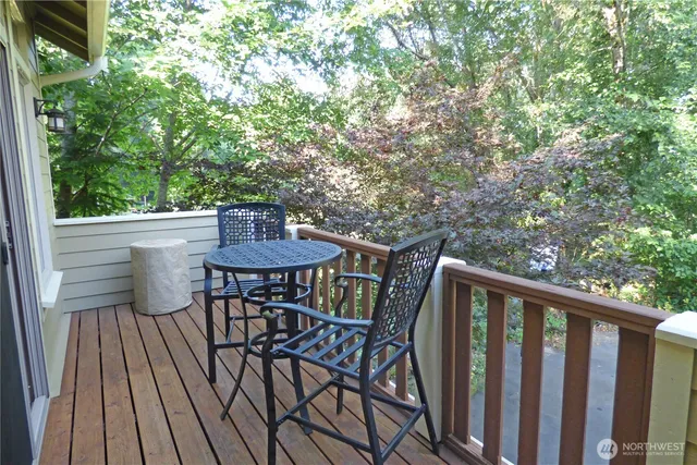 a living room with furniture a large window and a fireplace