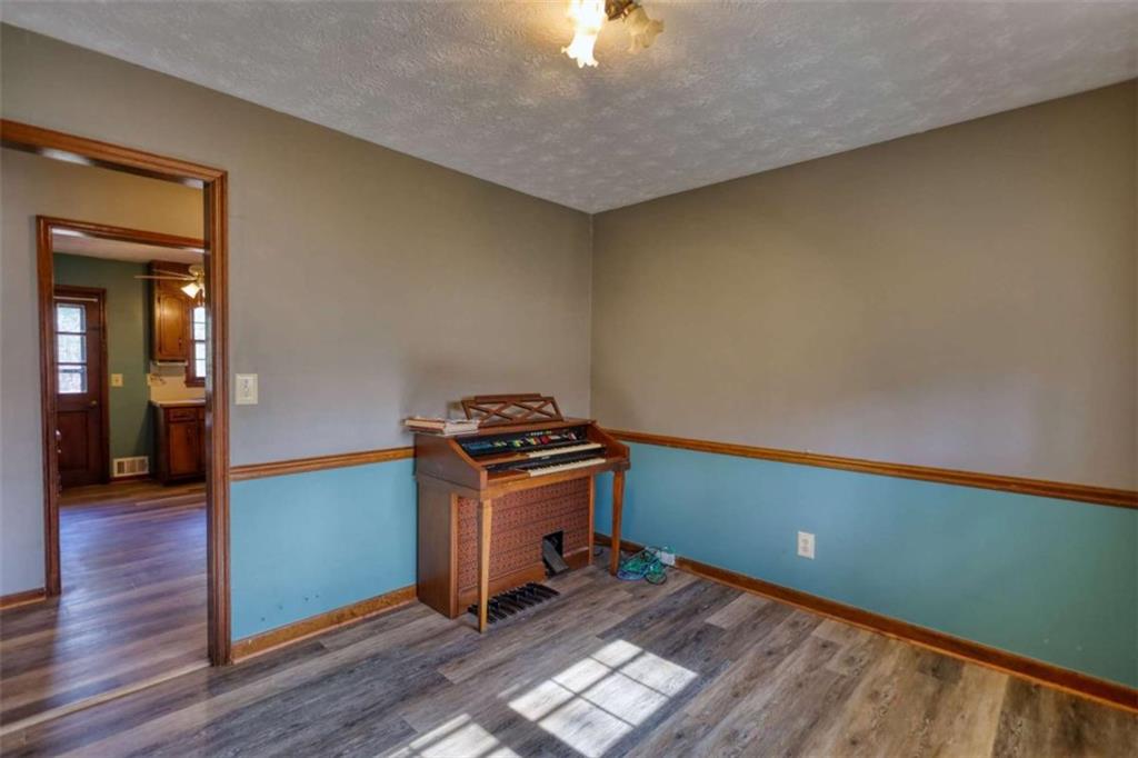 2289 Amberbrook Drive Southwest Conyers, GA 30094 - Photo 16 of 79 a room with furniture and wooden floor