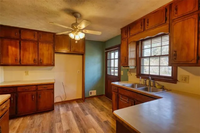 a en suite bathroom with a sink double vanity and a mirror