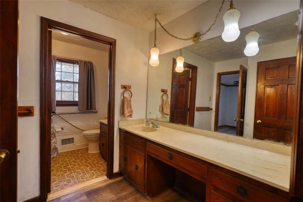 2289 Amberbrook Drive Southwest Conyers, GA 30094 - Photo 30 of 79 a bathroom with a sink and a mirror