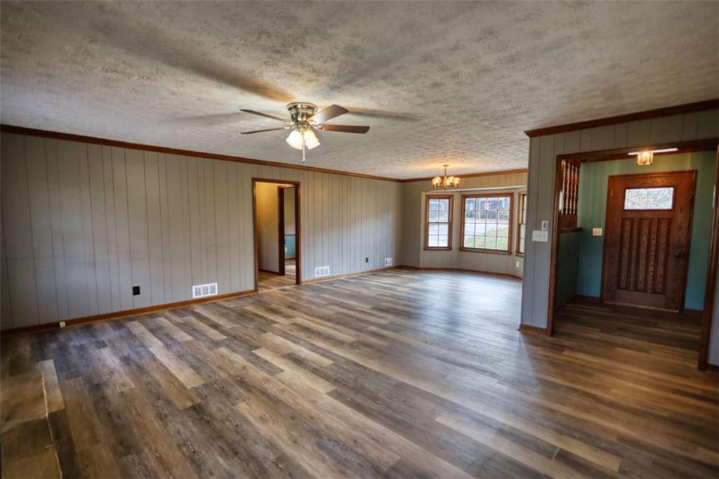 2289 Amberbrook Drive Southwest Conyers, GA 30094 - Photo 3 of 79 a view of empty room with wooden floor and fan