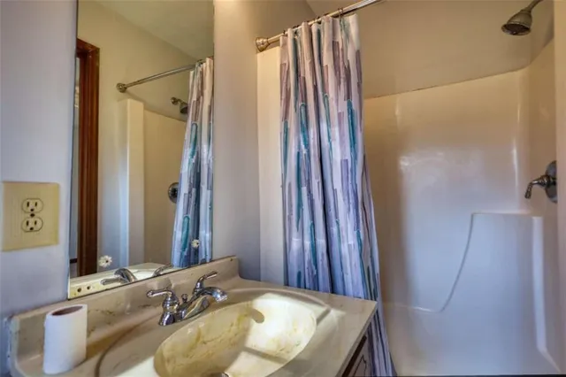 a bathroom with a tub and a shower