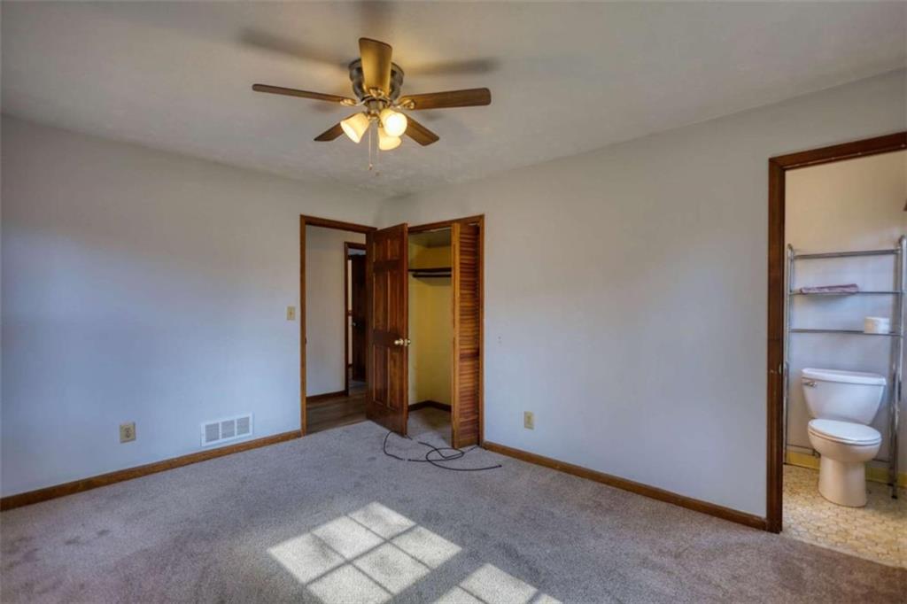 2289 Amberbrook Drive Southwest Conyers, GA 30094 - Photo 42 of 79 a view of an empty room with a chandelier fan