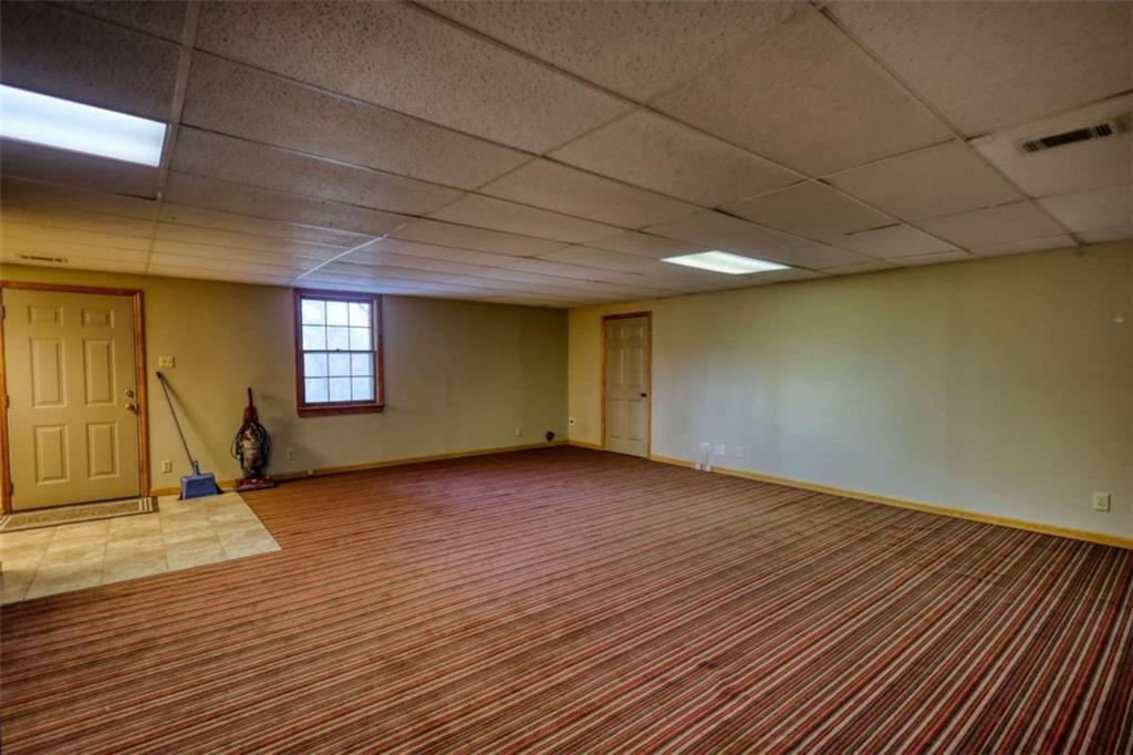 2289 Amberbrook Drive Southwest Conyers, GA 30094 - Photo 45 of 79 a view of an empty room with window and wooden floor