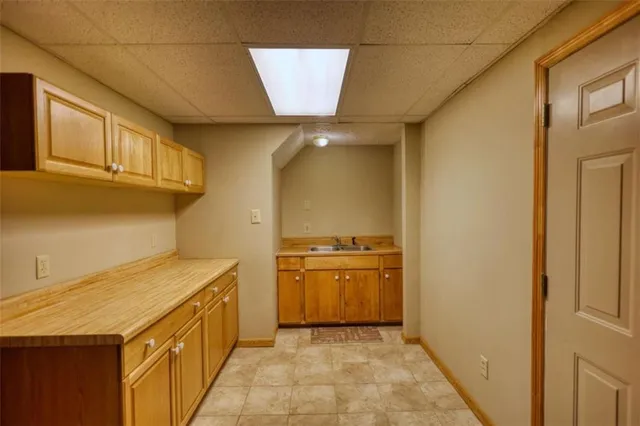 a view of a patio with table and chairs with wooden fence