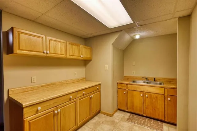 a view of a yard with large trees