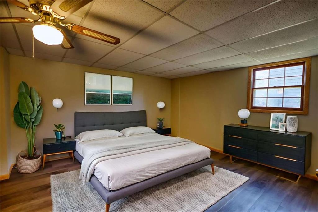 2289 Amberbrook Drive Southwest Conyers, GA 30094 - Photo 52 of 79 a bedroom with a bed and a chandelier