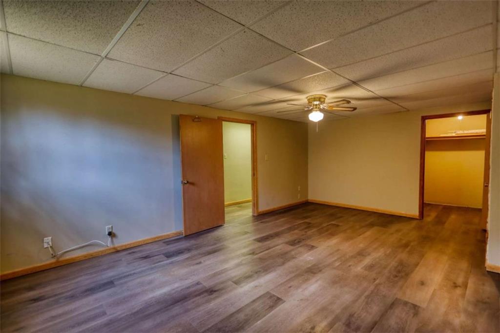 2289 Amberbrook Drive Southwest Conyers, GA 30094 - Photo 55 of 79 a view of an empty room with wooden floor