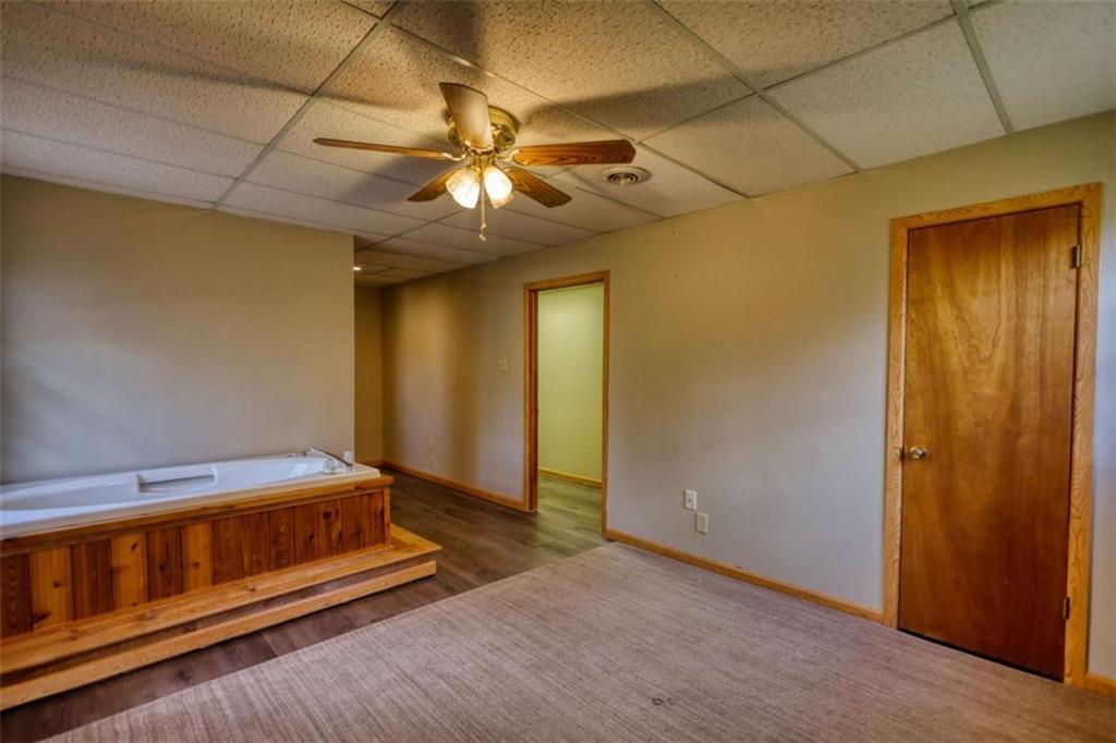 2289 Amberbrook Drive Southwest Conyers, GA 30094 - Photo 58 of 79 a bedroom with a bed and a chandelier