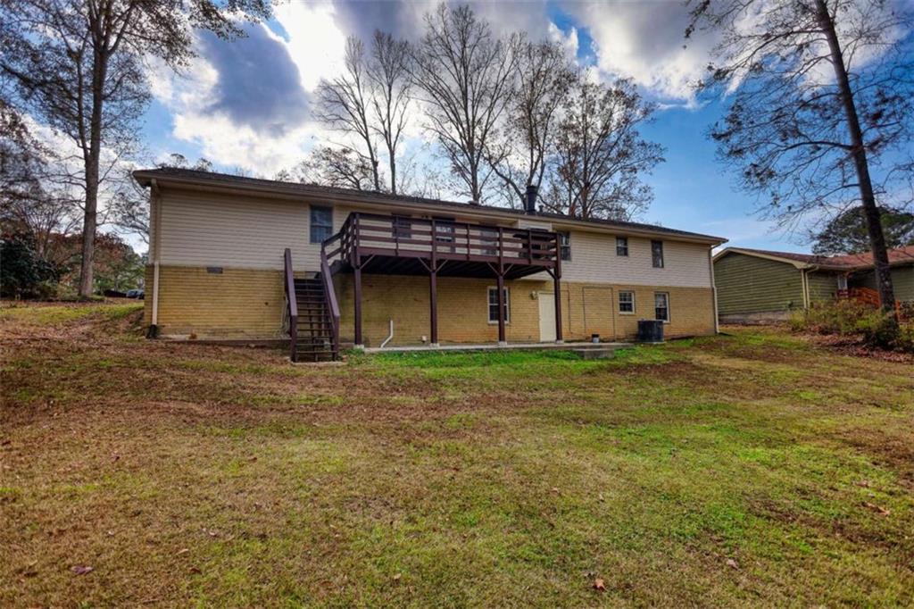 2289 Amberbrook Drive Southwest Conyers, GA 30094 - Photo 67 of 79 a view of a house with a back yard