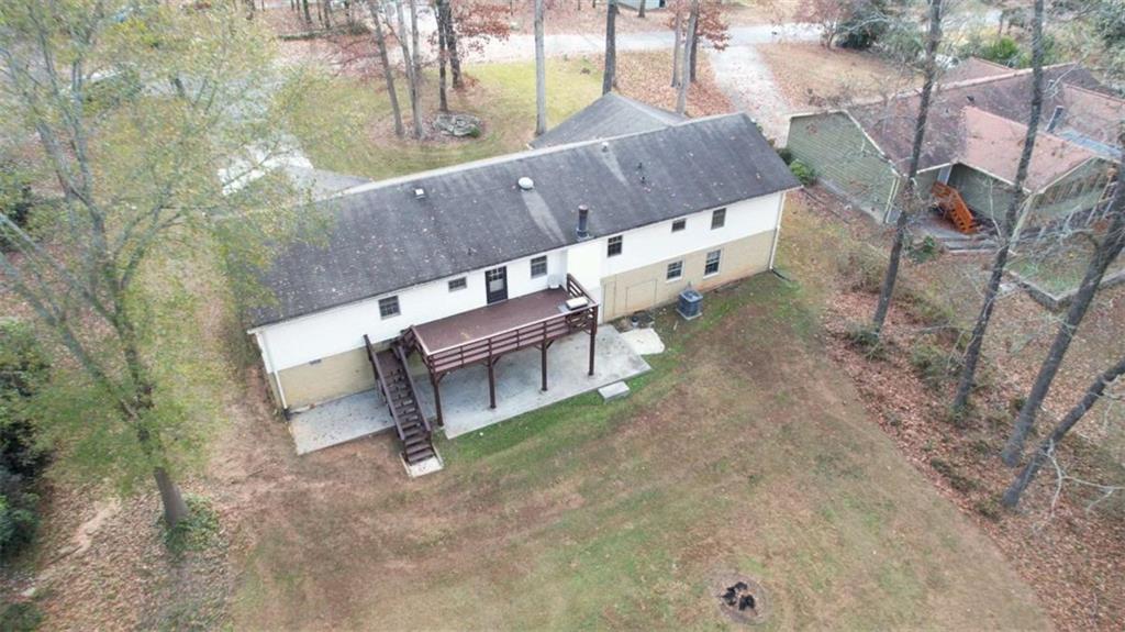 2289 Amberbrook Drive Southwest Conyers, GA 30094 - Photo 78 of 79 a view of a patio with table and chairs with wooden fence
