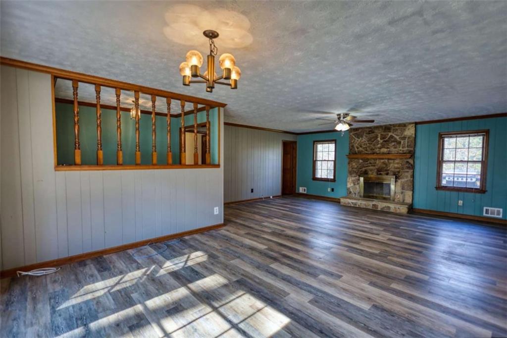 2289 Amberbrook Drive Southwest Conyers, GA 30094 - Photo 9 of 79 a view of a living room with wooden floor and a fireplace