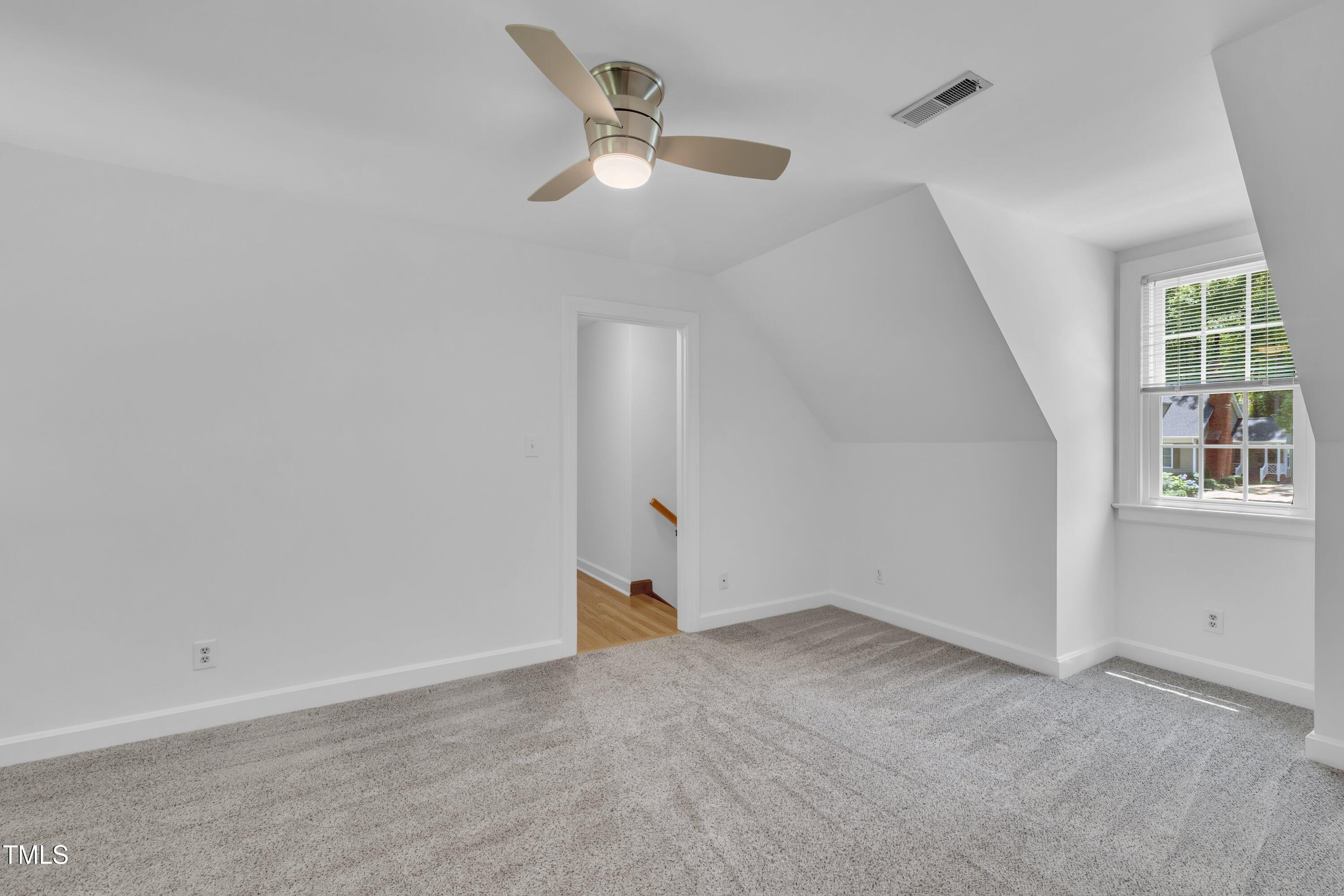 2204 Basil Drive Raleigh, NC 27612 - Photo 31 of 49 an empty room with fan and windows