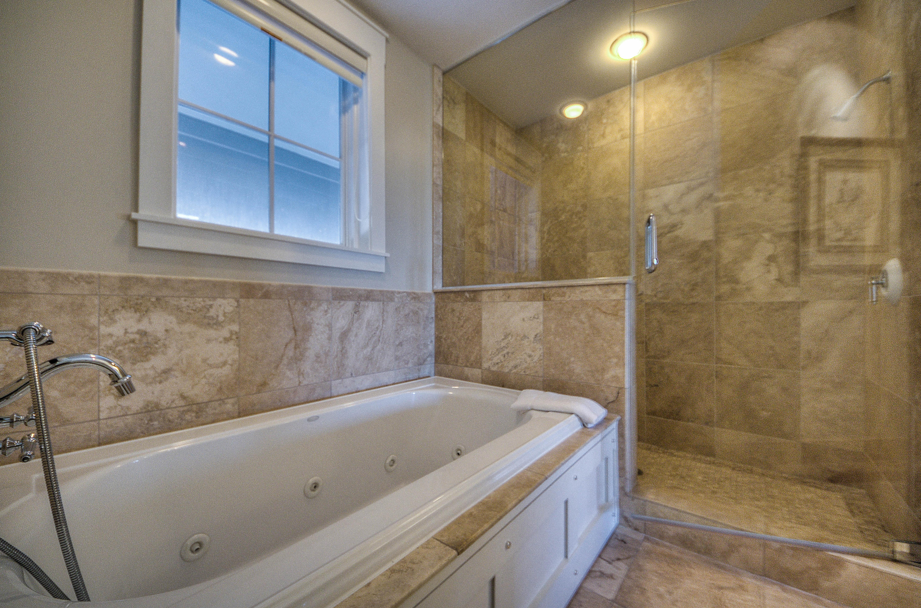 37 Compass Point Way, Unit 101 Watersound, FL 32461 - Photo 12 of 31 a bathroom with a bathtub and shower