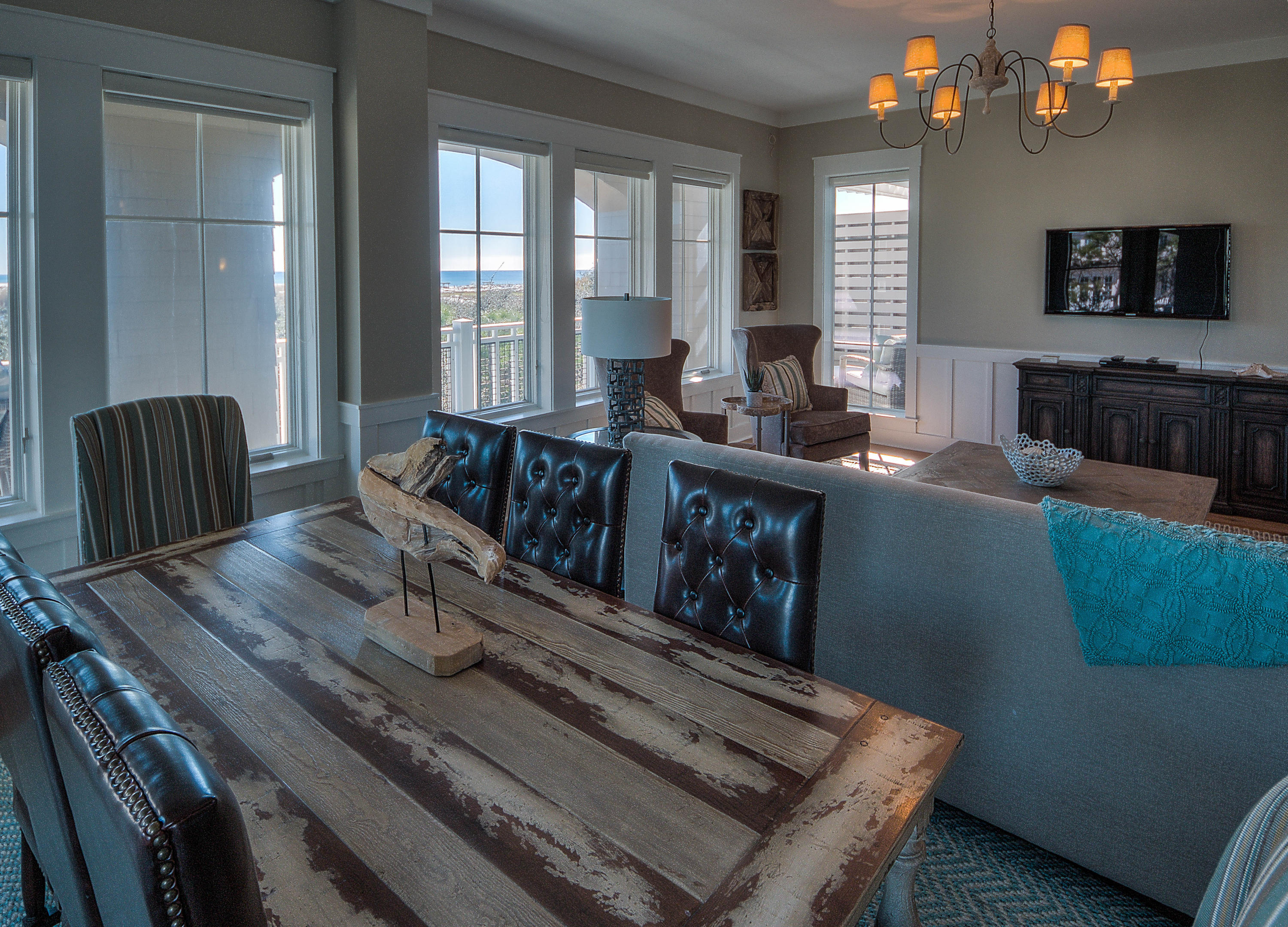 37 Compass Point Way, Unit 101 Watersound, FL 32461 - Photo 5 of 31 a living room with furniture and a flat screen tv