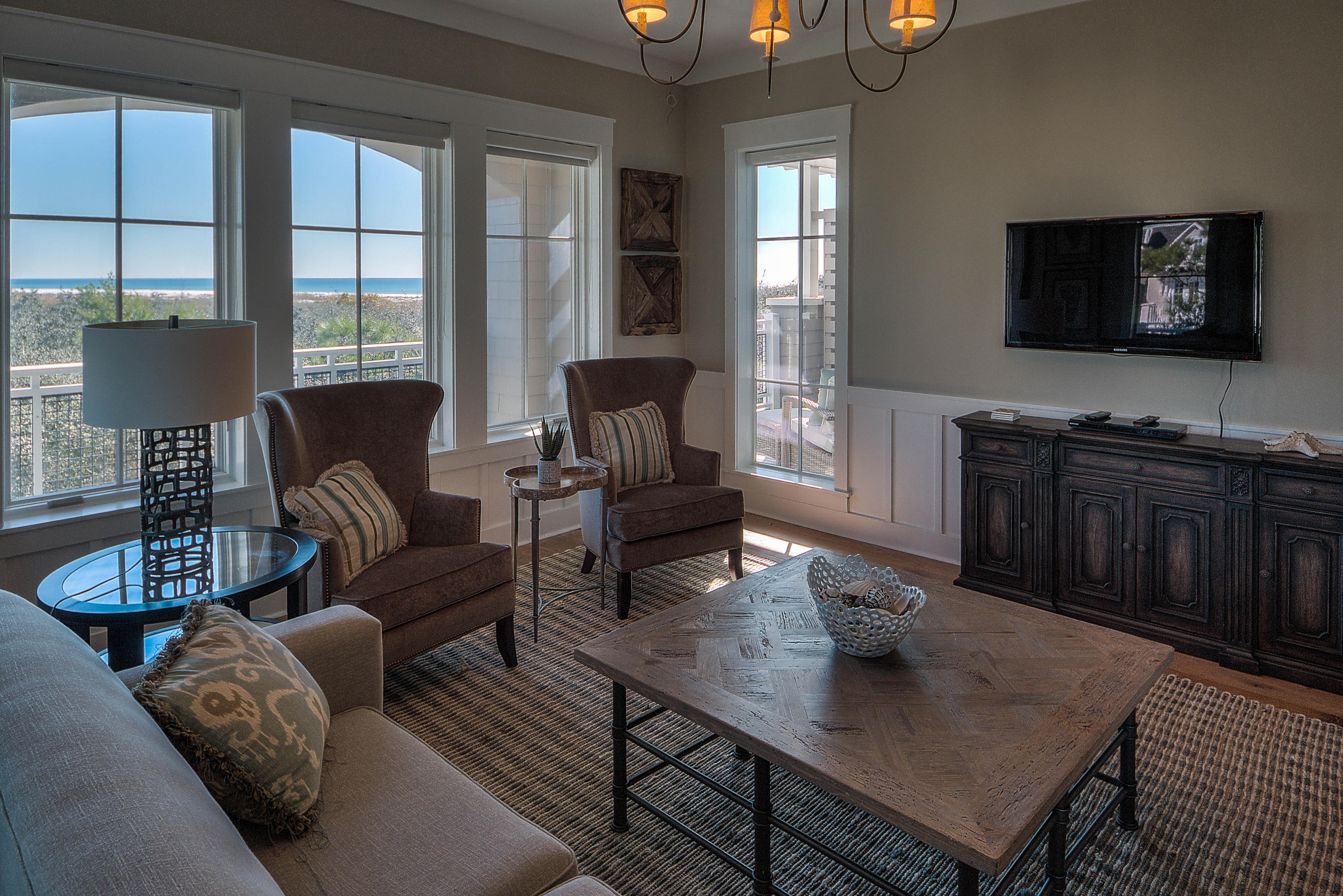 37 Compass Point Way, Unit 101 Watersound, FL 32461 - Photo 6 of 31 a living room with furniture and a flat screen tv
