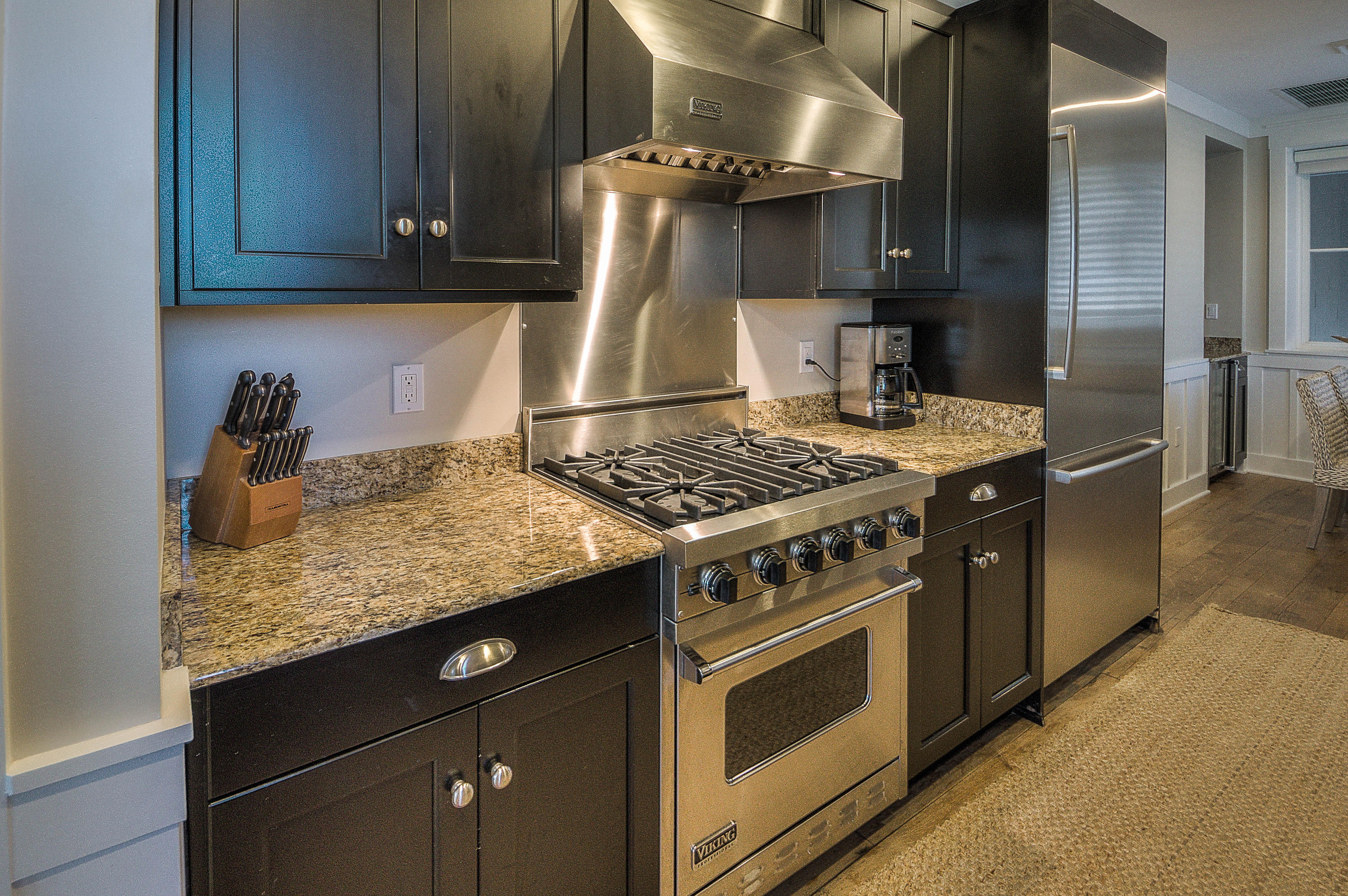 37 Compass Point Way, Unit 101 Watersound, FL 32461 - Photo 8 of 31 a kitchen with a stove and a cabinet