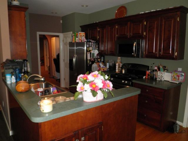 Kitchen area, it leads to the the office/playroom/ utility and half bath.