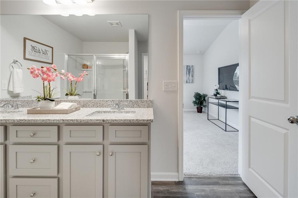 7441 Knoll Hollow Road Lithonia, GA 30058 - Photo 31 of 46 a bathroom with a sink and a mirror