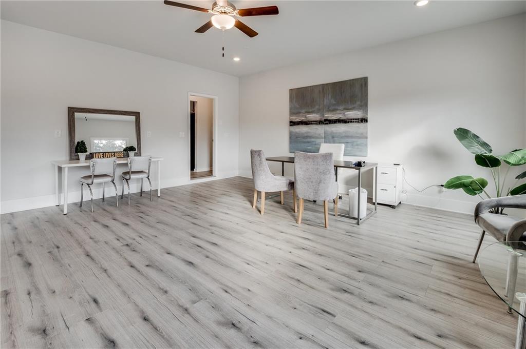 7441 Knoll Hollow Road Lithonia, GA 30058 - Photo 7 of 46 a living room with furniture wooden floor and a window