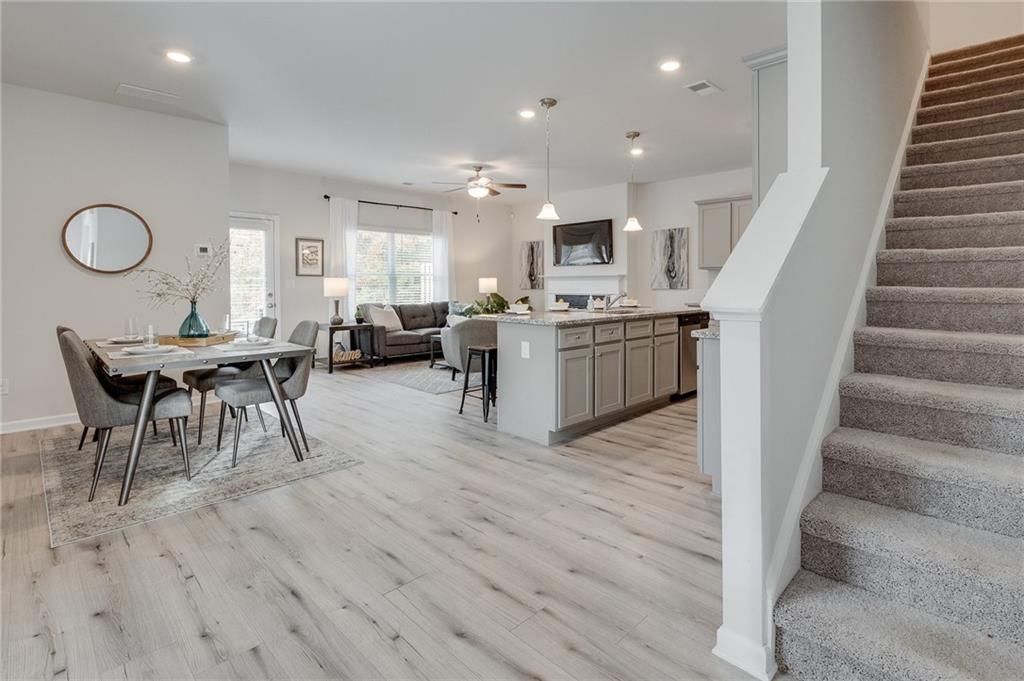 7441 Knoll Hollow Road Lithonia, GA 30058 - Photo 9 of 46 a living room with furniture appliances and a wooden floor