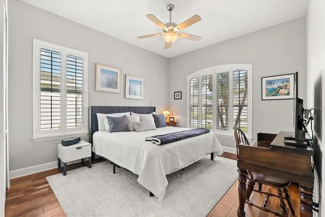 a bedroom with a bed and a desk