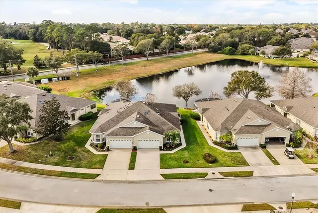 an aerial view of residential houses with outdoor space