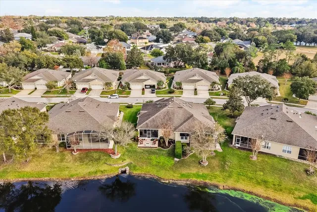 an aerial view of residential houses with swimming pool