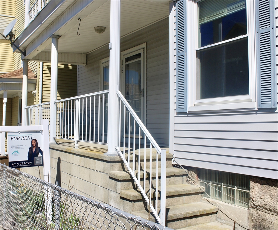 136 Horton Street, Unit 1 Fall River, MA 02723 - Photo 1 of 17 a view of wooden staircase and a living room