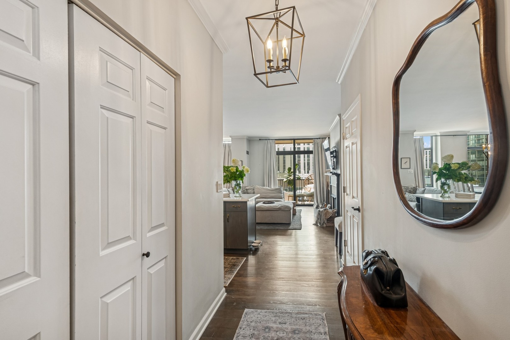1122 North Dearborn Street, Unit 8E Chicago, IL 60610 - Photo 2 of 16 a view of a livingroom with furniture and a mirror