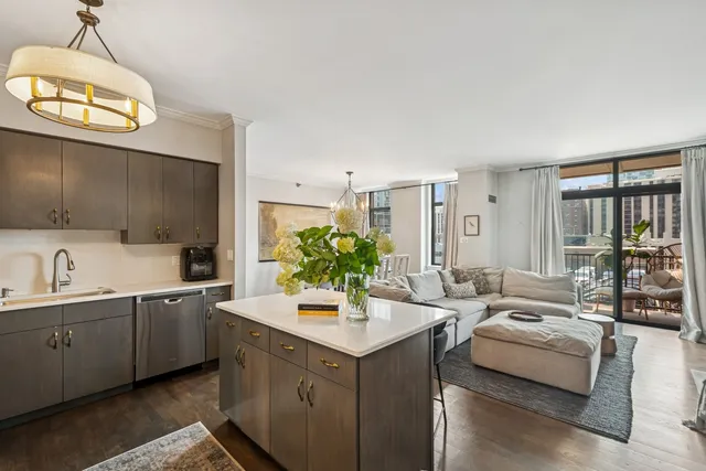 a view of living room with granite countertop furniture and fireplace