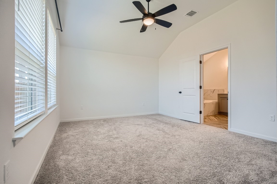 7904 Gilwice Lane Austin, TX 78744 - Photo 12 of 24 wooden floor in an empty room with a window