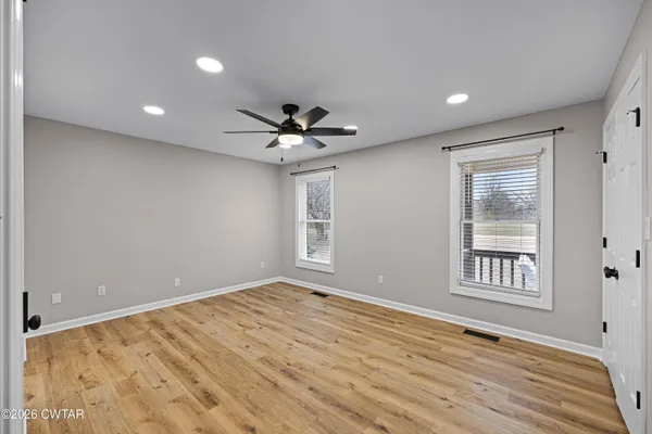 a view of an empty room with a window
