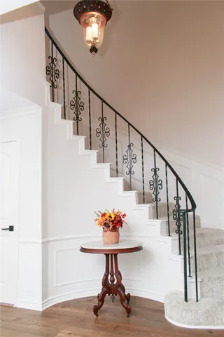 a view of entryway and hall with wooden floor