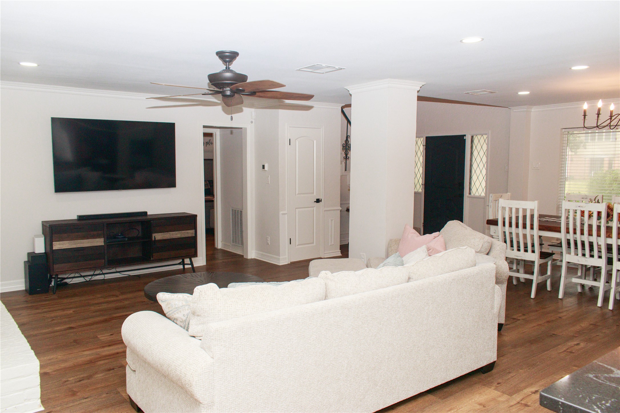 7510 Ralick Court Spring, TX 77379 - Photo 18 of 44 a living room with furniture a flat screen tv and a fireplace