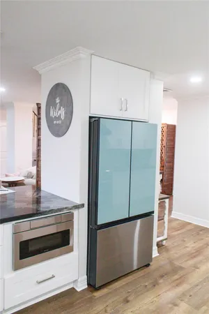 a kitchen with a stove a sink and a refrigerator