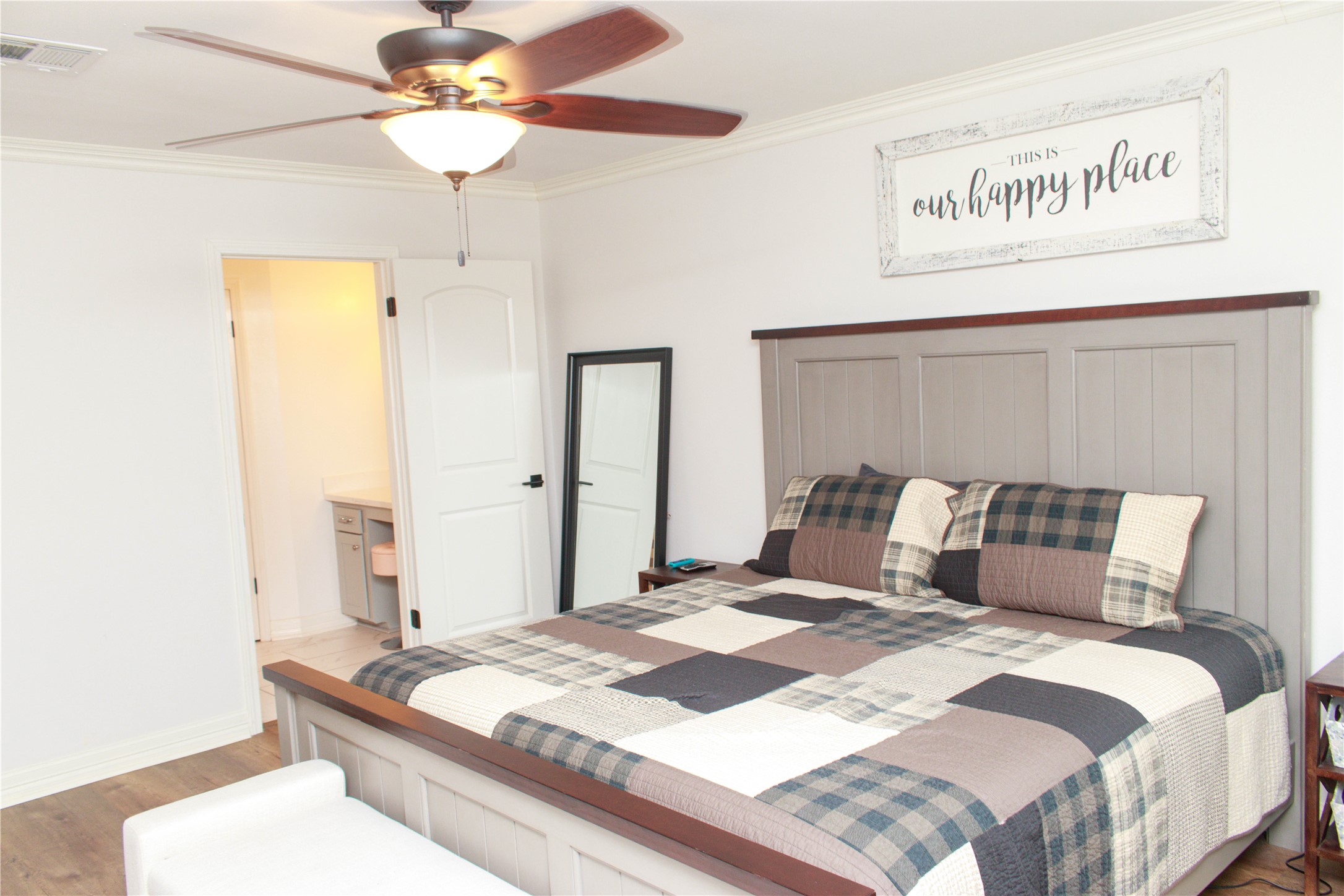 7510 Ralick Court Spring, TX 77379 - Photo 27 of 44 a bedroom with a bed and a chandelier