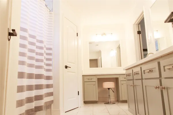 a bathroom with a bathtub and shower